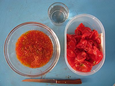 squeeze out the fleshy tomato pulp containing the seeds