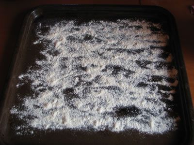 Use a baking pan and spread some of the flourΙ